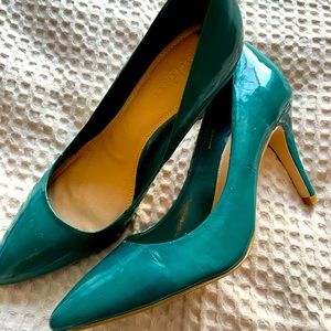 Teal patent pumps